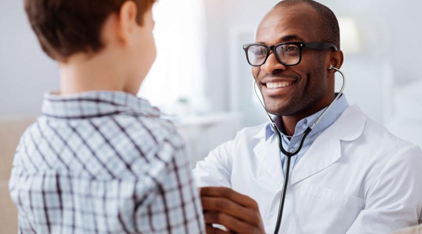 Doctor examining a child's respiratory system