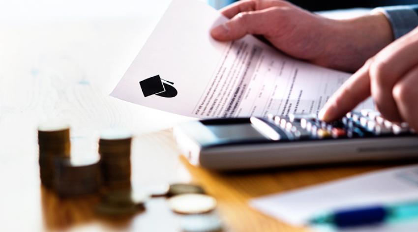 Man counting fee or student loan with calculator. 