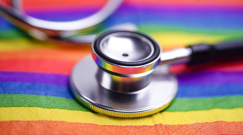 A stethoscope on a rainbow flag