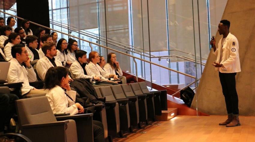 Taiwo Alonge speaks to students and faculty at Columbia University Vagelos College of Physicians and Surgeons in New York City during a teach-in he co-organized during his first year of medical school in 2017.