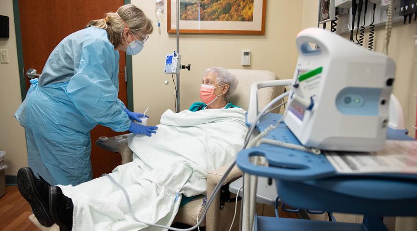 Nurse Pam Burke cares for Sarah Kirby as she receives a monoclonal antibody infusion at Memorial Health System in Illinois.