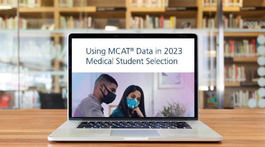 Laptop showing the cover of the Using MCAT Data in 2023 Medical Student Selection guide