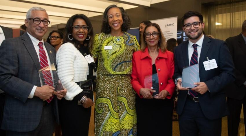 AAMC leadership poses with awards
