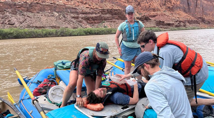 Eric Macaluso, DO, practices rescue techniques on Colorado’s Green River during a training