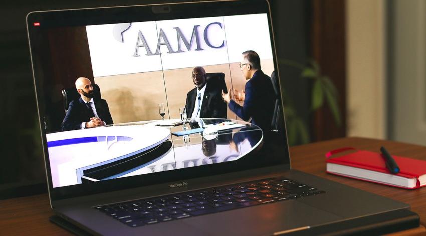 Philip Alberti, David Satcher, and Daniel Dawes appear on a laptop screen