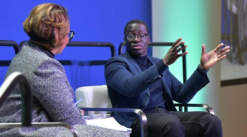 Joel Bervell, MD, speaks onstage with Dorian Harriston-Celler, MA, Chief Marketing and Communications Officer at Morehouse School of Medicine, during Learn Serve Lead 2023 in Seattle.