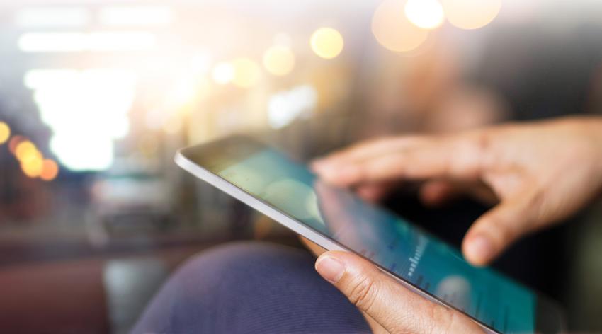 Businessman using tablet at night time