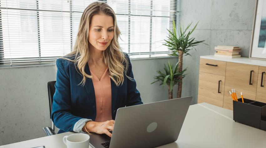 Businesswoman working on a computer in the office.