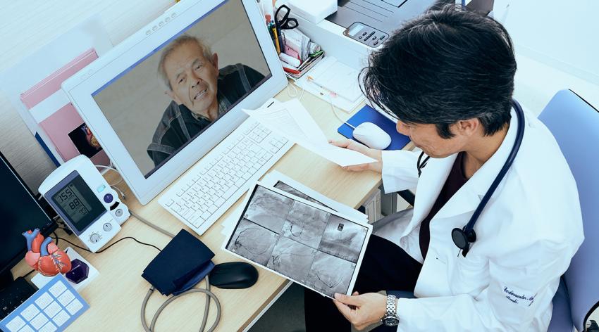 Cardiovascular doctor looking at coronary x-ray output