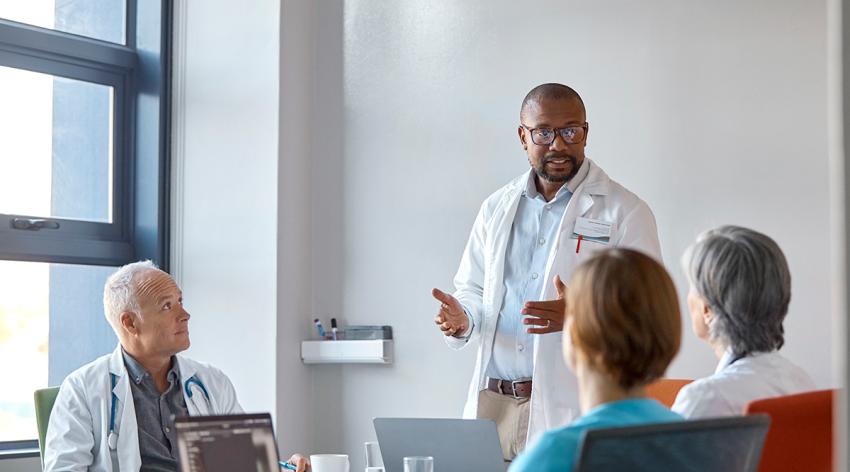 Medical expert giving presentation during meeting