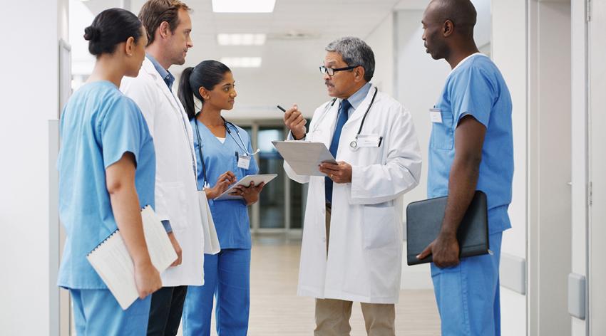 A group of medical practitioners having a discussion in a hospital