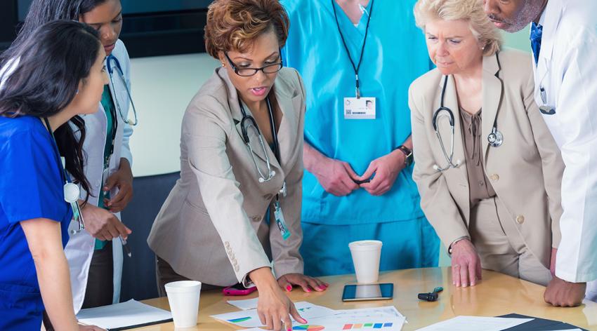 Medical team reviewing hospital financial information