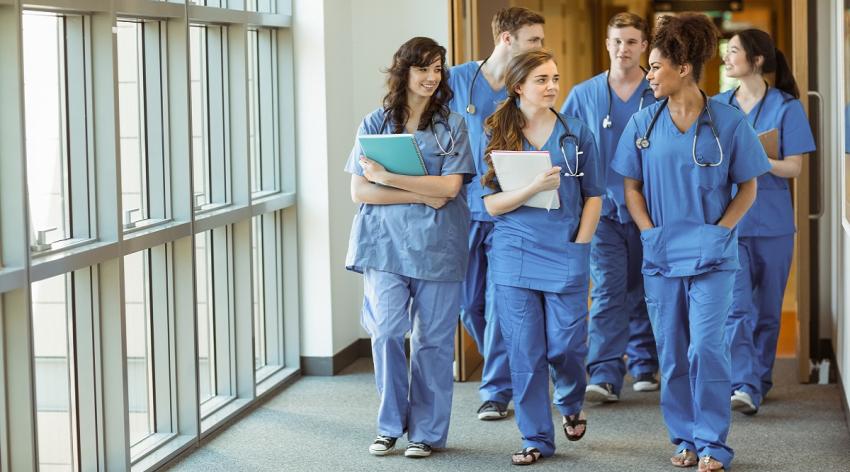 Medical students walking through corridor at the university