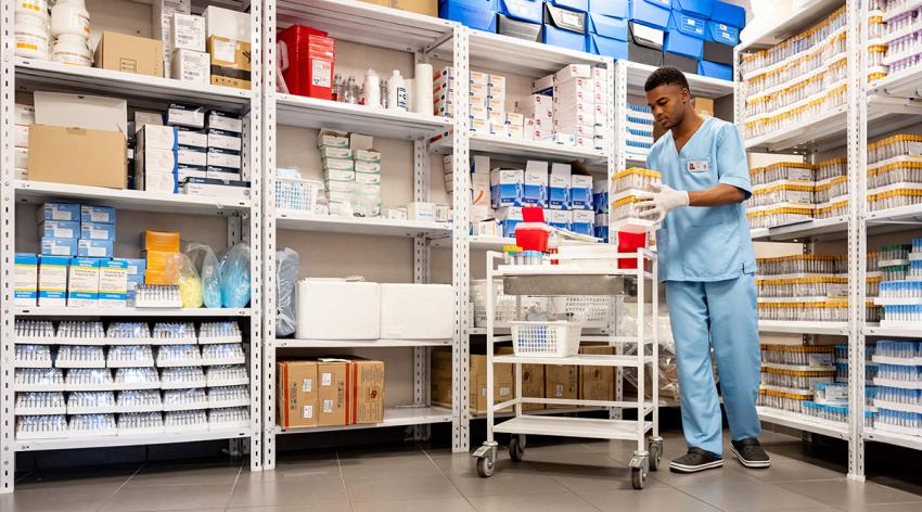 A nurse organizing medical supplies at the hospital laboratory