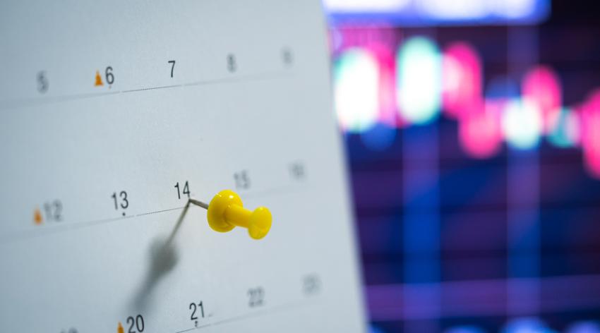 Push pin on marked calendar