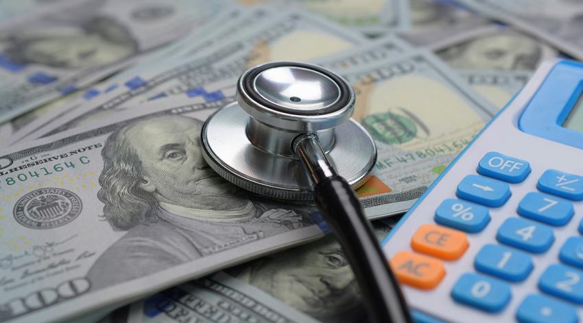 Stethoscope and big money US dollar