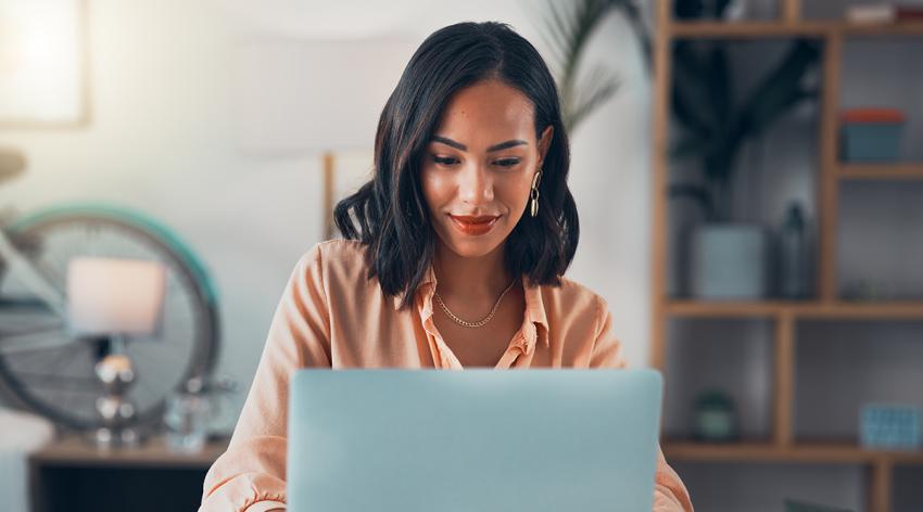 Woman working on laptop online