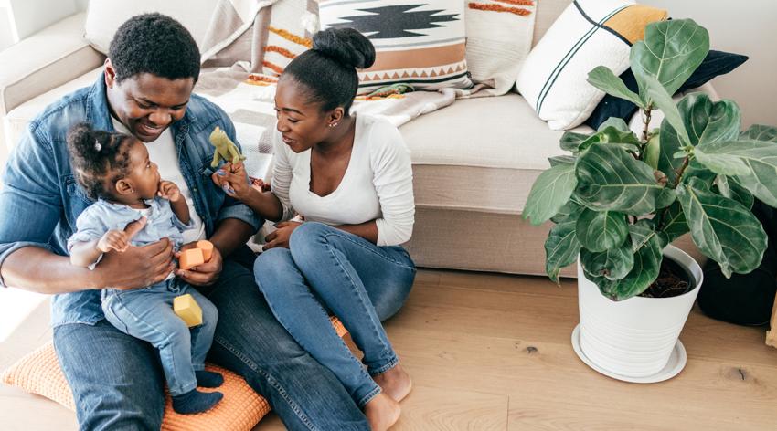 Young family at home with one little child