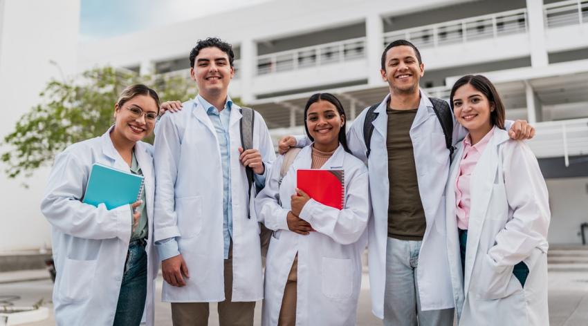 Portrait of young medical students friends outside the university