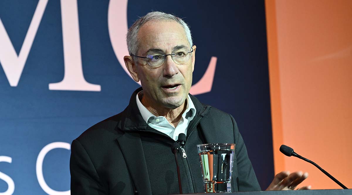 Thomas Insel, MD, speaks at a podium during Learn Serve Lead 2022