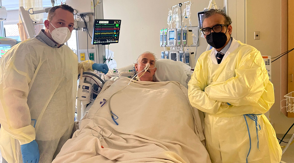Patient David Bennett (center), with his son, David Bennett Jr. (left), and surgeon Muhammad Mohiuddin, MD (right), after a team of doctors transplanted a pig heart into Bennett at the University of Maryland Medical Center.