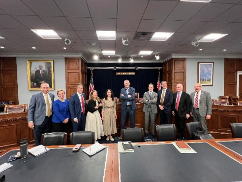 Leaders pose in a court room