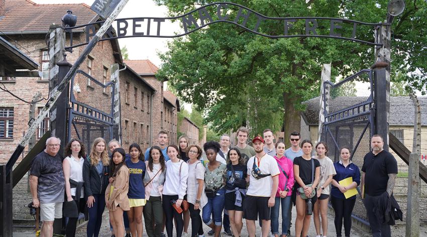 Students and faculty from Oakland University William Beaumont School of Medicine spent a week in Poland in June to better understand the Holocaust. Here they are shown at the gate of the former Auschwitz 1 concentration camp.
